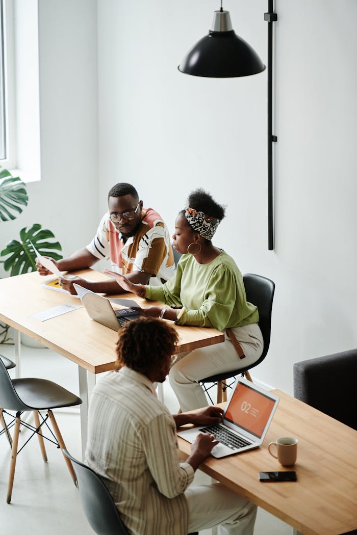 Diverse team working together in a modern, bright office space.